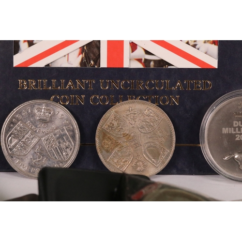 154 - A small collection of commemorative crown and £5 coins together with two medallions and a coin brace... 