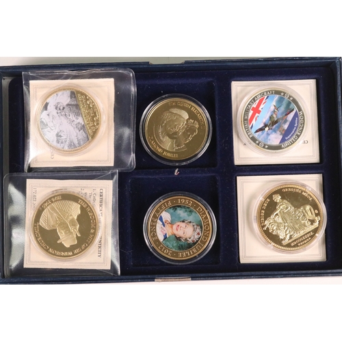 173 - A selection of commemorative collectors coins housed within three fitted boxes to include Winston Ch... 