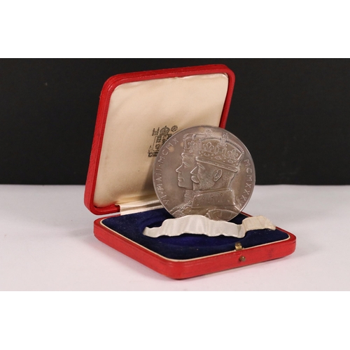 107 - A British 1935 King George V silver jubilee 58mm silver medallion within original issue fitted case.