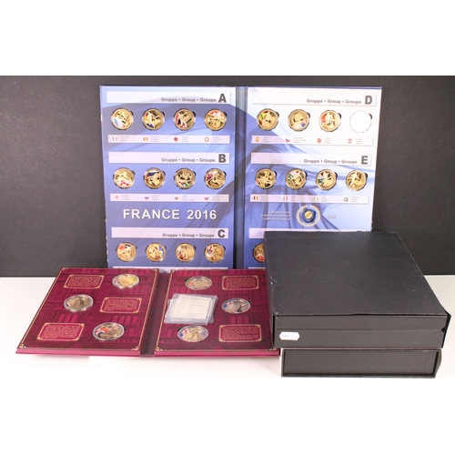 121 - A group of collectors coins within fitted albums and boxes to include Football France 2016, Queen El... 