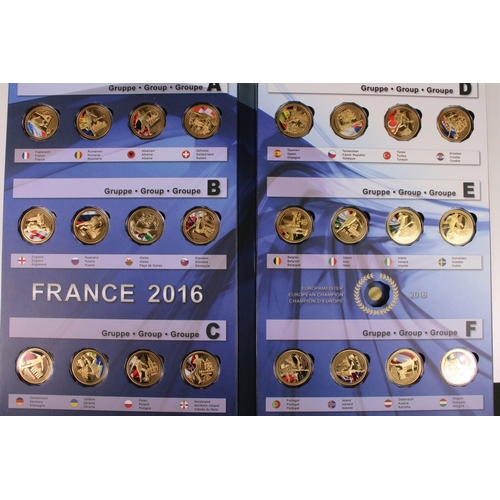 121 - A group of collectors coins within fitted albums and boxes to include Football France 2016, Queen El... 