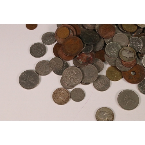 122 - A collection of British decimal, pre decimal and world coins to include some silver examples.