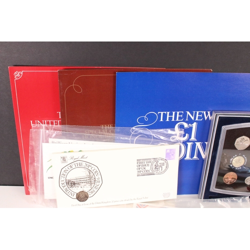 201 - A collection of mainly United Kingdom coins to include uncirculated, year sets, commemorative crowns... 