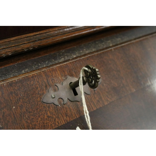 716 - 20th century mahogany four drawered veneered writing bureau bookcase with glazed front and pull down... 