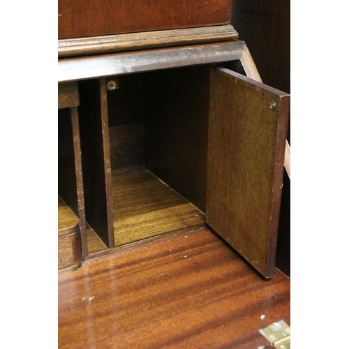 716 - 20th century mahogany four drawered veneered writing bureau bookcase with glazed front and pull down... 