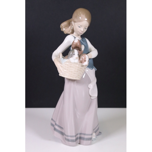 106 - Collection of Llladro and Nao figurines to include Lladro 2000 event figurine 6741, girl with mirror... 