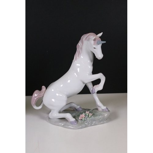 110 - Assortment of Lladro and Nao figurines to include a unicorn, bisque finish unicorn, butterfly, bunni... 