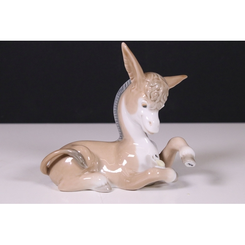 110 - Assortment of Lladro and Nao figurines to include a unicorn, bisque finish unicorn, butterfly, bunni... 