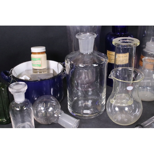 113 - Assortment of vintage chemist items to include glass beakers, bottles, eyebath and equipment, with g... 