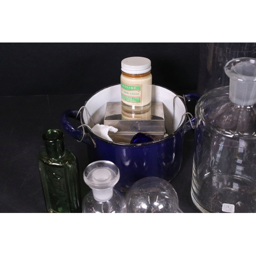 113 - Assortment of vintage chemist items to include glass beakers, bottles, eyebath and equipment, with g... 