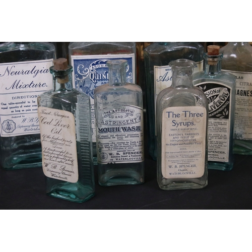 114 - Collection of vintage apothecary glass jars and bottles with original labels and one embossed exampl... 