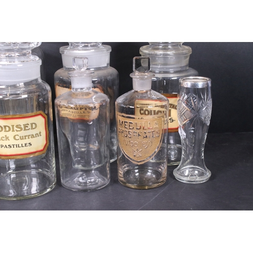 114 - Collection of vintage apothecary glass jars and bottles with original labels and one embossed exampl... 