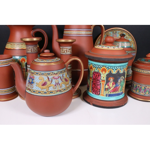 116 - Selection of terracotta Prattware to include tea pot, coffee pot, lidded jar, candle sticks, two sma... 