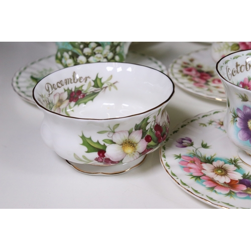 126 - Royal Albert 'Flower of the Month' series trio tea cups, saucers and plates sets, to include all mon... 