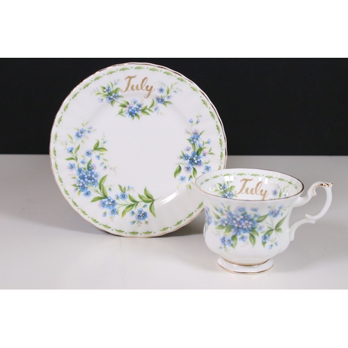 126 - Royal Albert 'Flower of the Month' series trio tea cups, saucers and plates sets, to include all mon... 