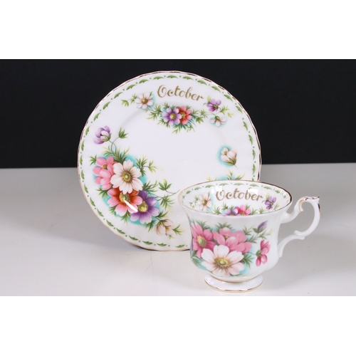 126 - Royal Albert 'Flower of the Month' series trio tea cups, saucers and plates sets, to include all mon... 