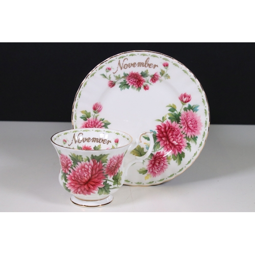 126 - Royal Albert 'Flower of the Month' series trio tea cups, saucers and plates sets, to include all mon... 