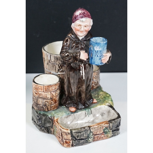 137 - Ceramic figurines to include a majolica monk smoke stand match holder, Royal Doulton 'Fortune Teller... 