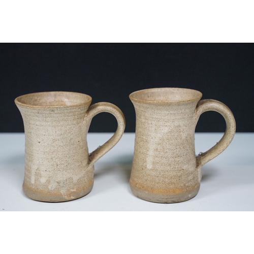 147 - Assorted studio pottery pieces to include two Wilsker cups together with wine goblets, cups and sauc... 