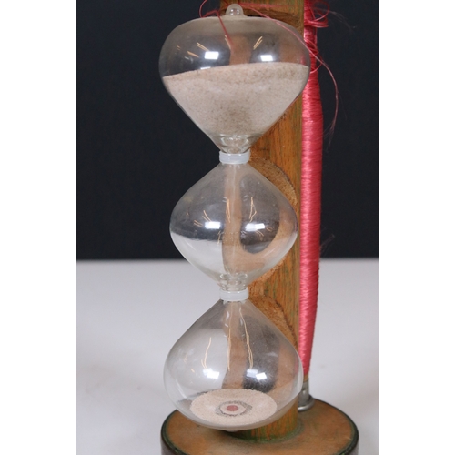 170 - Vintage glass egg timer with three bulbous tiers held on an old mill bobbin incorporating a reel of ... 