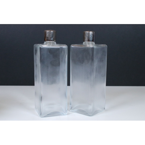 174 - Pair of square glass spirit flask with white metal screw on tops fitted in a brown leather case with... 