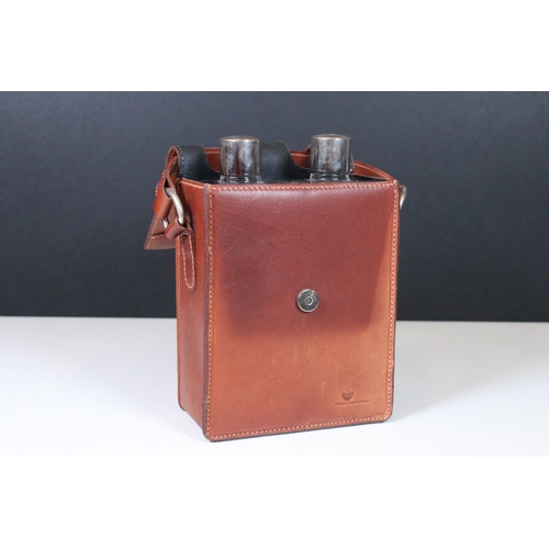 174 - Pair of square glass spirit flask with white metal screw on tops fitted in a brown leather case with... 