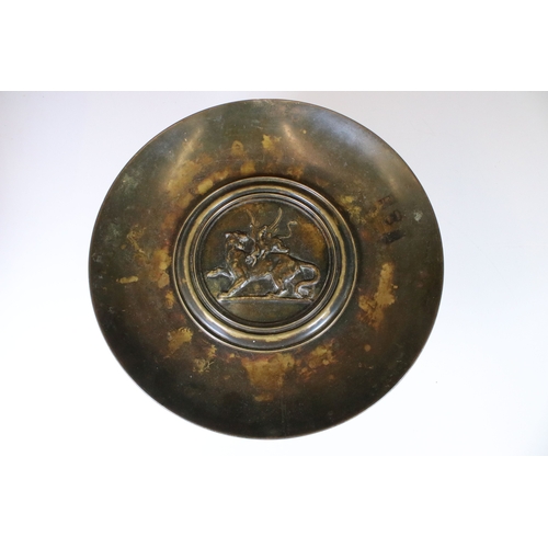 176 - 19th century bronze footed tazza with fighting beasts decoration to centre, H 17cm, 32cm diameter