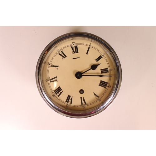 188 - F W Elliot Ltd, London, ships maritime bulk head clock with key, H 8cm, 20cm diameter