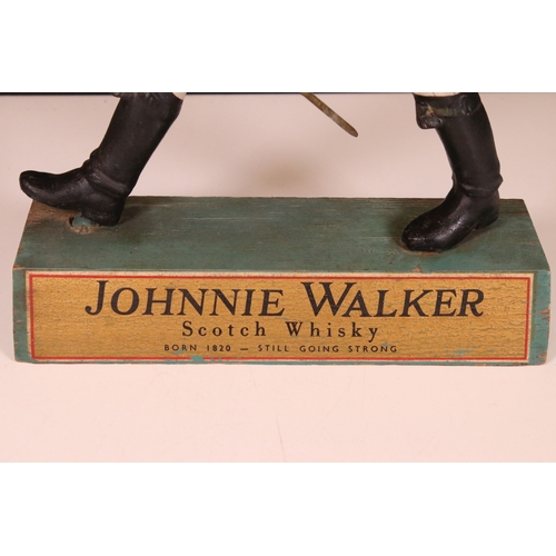 191 - Johnnie Walker 'Scotch Whisky' vintage advertising figure on wooden stand, H 39cm