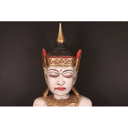 199 - Seated carved wooden hand painted Thai figure in headdress, H 58cm