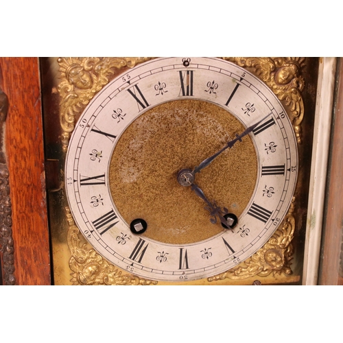 210 - Lenz Kirch wooden cased mantle clock with metal detail and decorative finials raised on lions feet