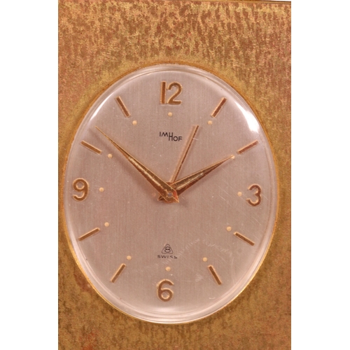 223 - A 20th century gilt desk clock, the cream dial inscribed 'IM HOF, Swiss', height is approx 12cm.