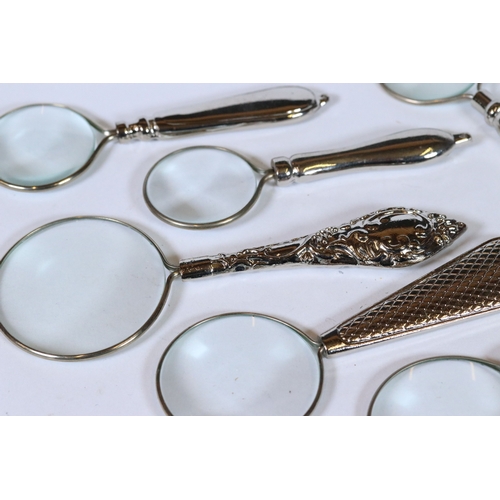 231 - Set of six graduated magnifying glasses with silver plated handles