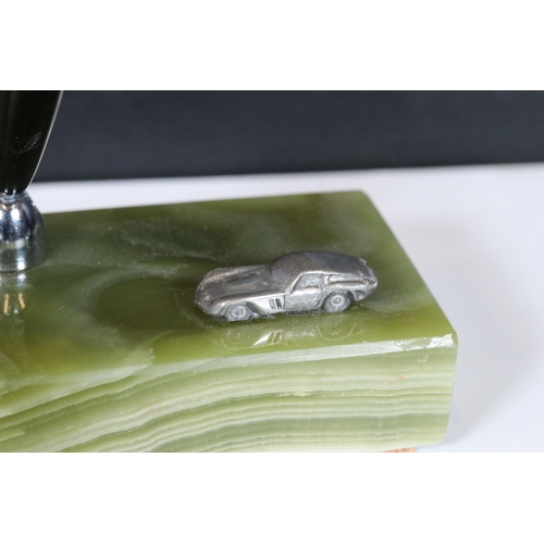 236 - A collection of six desk top pen holders, green agate bases adorned with car makers badges to includ... 