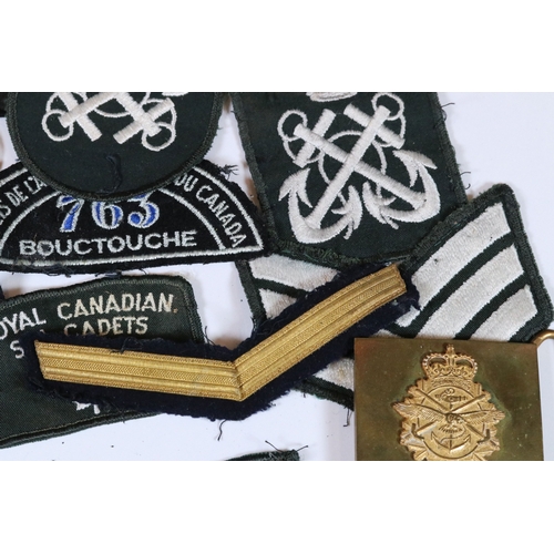 240 - A collection of badges and cloth patches to include Motorcycle, Military and Sports interest.