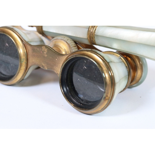 243 - A pair of Lucerne French opera glasses with mother of pearl paneled decoration.