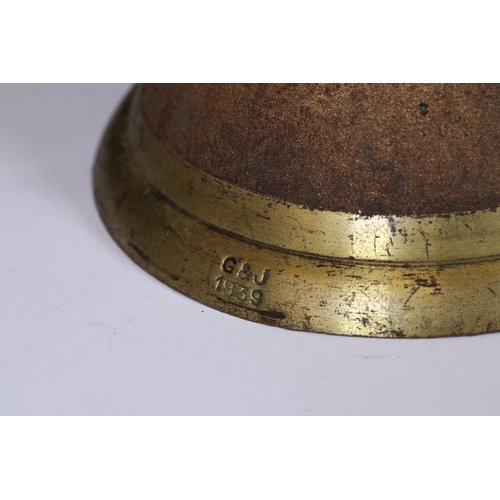 244 - A mid 20th century brass hand bell, stamped A.R.P. (Air Raid Precautions).