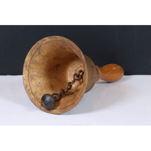 244 - A mid 20th century brass hand bell, stamped A.R.P. (Air Raid Precautions).