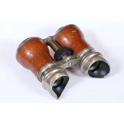 245 - A pair of early 20th century French leather covered binoculars.