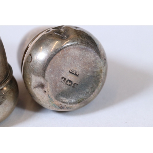 247 - A pair of hallmarked silver salt shakers in the form of Acorns within fitted display case, together ... 