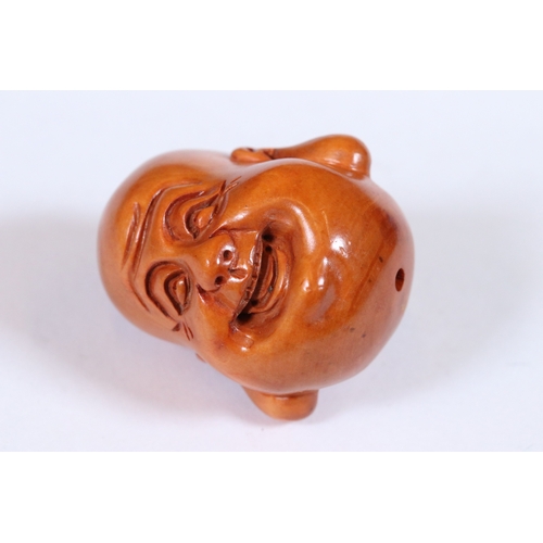 269 - Two wooden netsuke figures to include signed Happy Buddha and a signed Ram