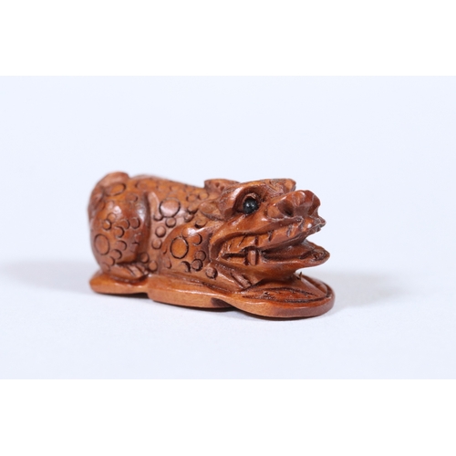 272 - Four miniature wooden netsuke / figures to include Monkey, Money Dragon, girl with pet and mouse wit... 