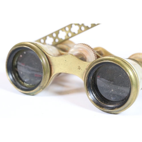 274 - A pair of antique brass and mother of pearl opera glasses.