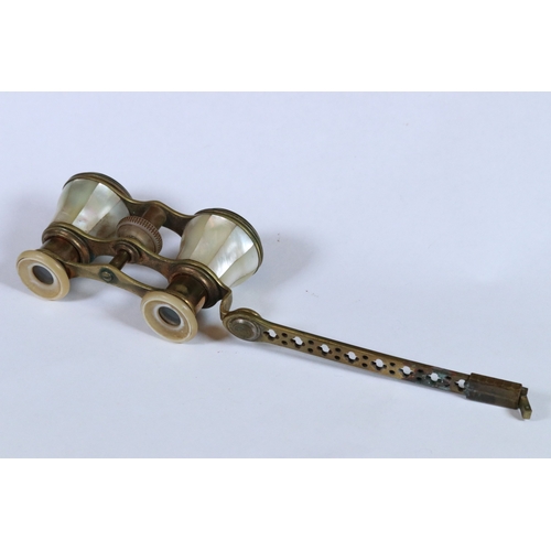 274 - A pair of antique brass and mother of pearl opera glasses.