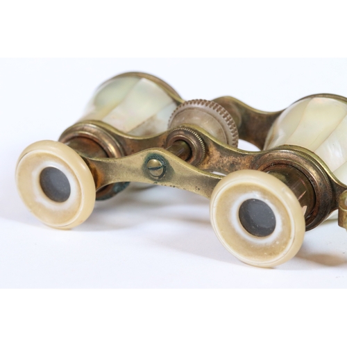 274 - A pair of antique brass and mother of pearl opera glasses.