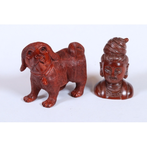 277A - Two wooden netskue figures to include a signed Buddha and a dog