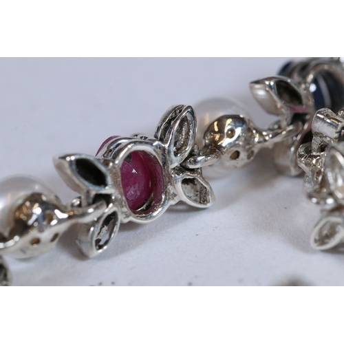 293 - Multi silver stone set bracelet to include sapphire, ruby and emerald