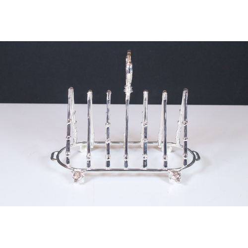 323 - Substantial silver plated country style toast rack with fox mask feet