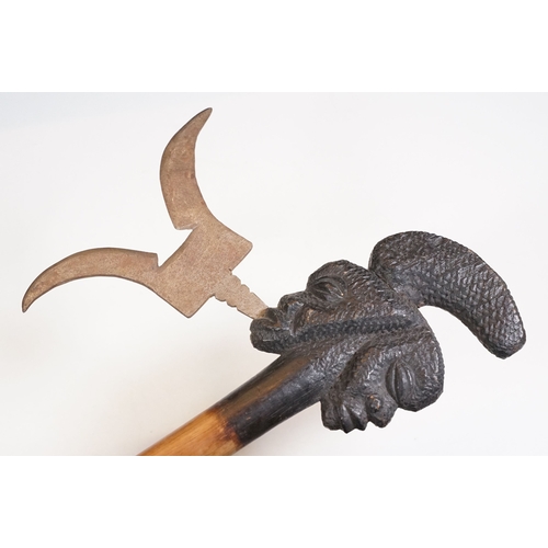 457 - Two African Tribal ceremonial axes with carved wooden heads / face detailing to tops with axe blades... 