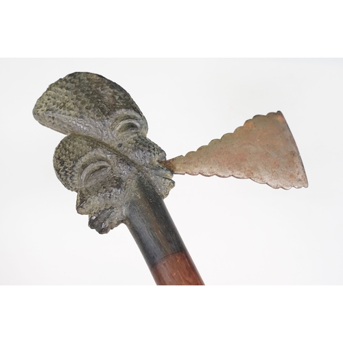 457 - Two African Tribal ceremonial axes with carved wooden heads / face detailing to tops with axe blades... 